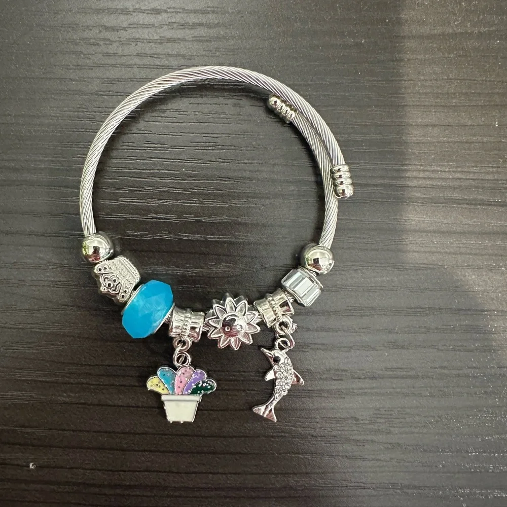 Stainless Steel Cable Charm Bracelet – Blue Bead Dolphin & Celestial Charms